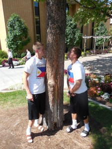 Elders Burbidge and Salisbury sniffing a tree that "smells like cream soda!"