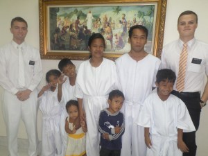 The Lachiga family, Elder Collins, and Elder Burbidge ready for baptisms.
